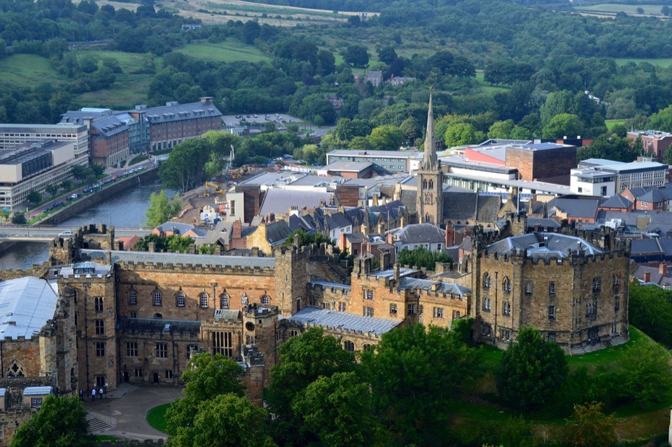 Durham seen from the top of the cathedral tower, with the castle and the rooftops below it