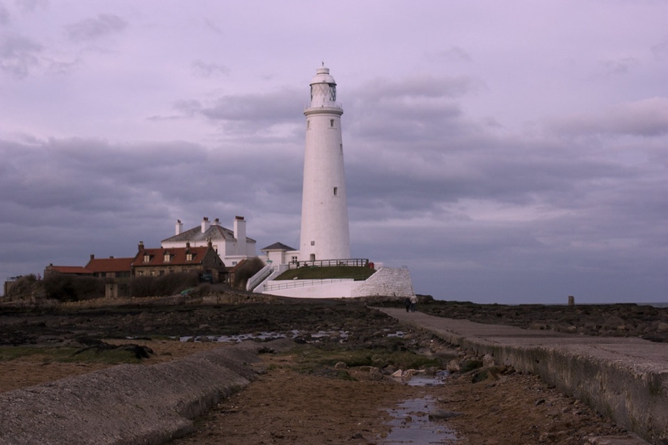St Marys lighthouse and its keepers cottages at Whitley Bay at dusk